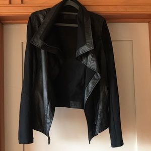 Faux leather jacket with fabric sleeves